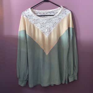 Adorable light sweater.